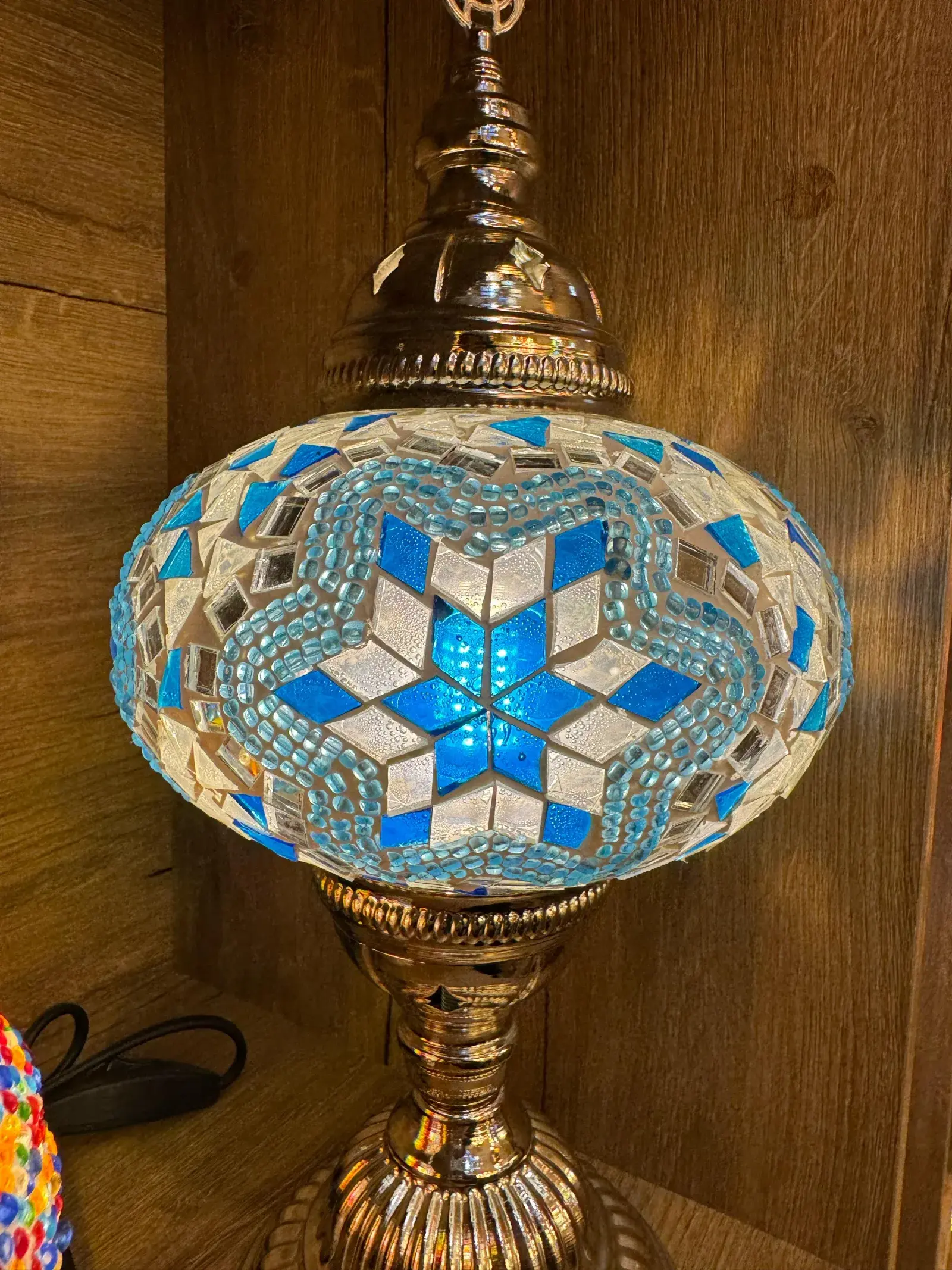 Deep-blue and crimson mosaic lamp on a polished brass stand from our Balat workshop
