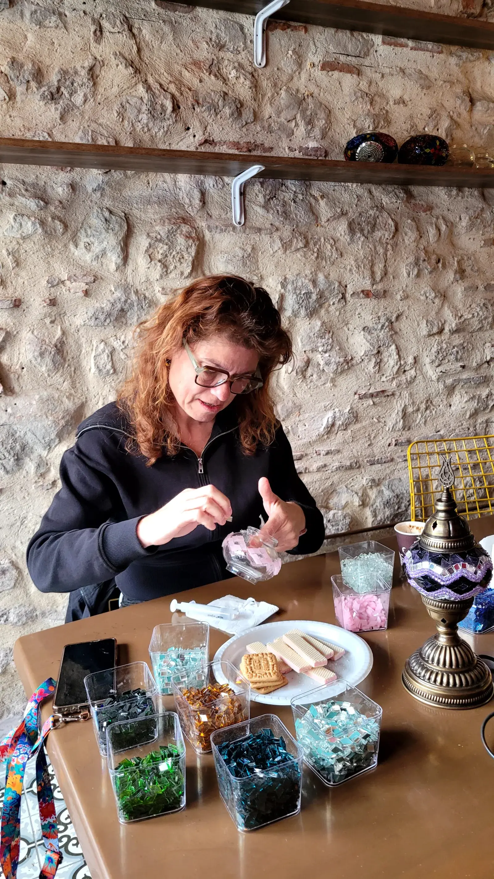 Wide view of glass tesserae and a mosaic lamp in progress at our Balat workshop