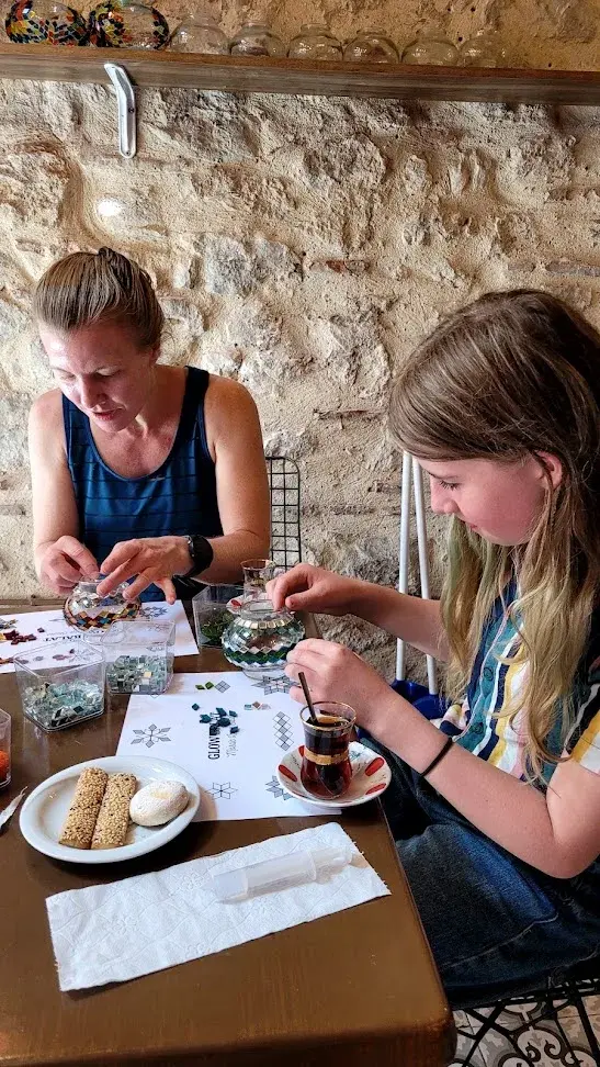 Final touches on a mosaic lamp during a workshop in Balat, Istanbul